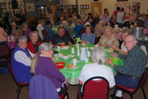 These folks enjoy the soup, cornbread, and conversation at Simply Soup. 